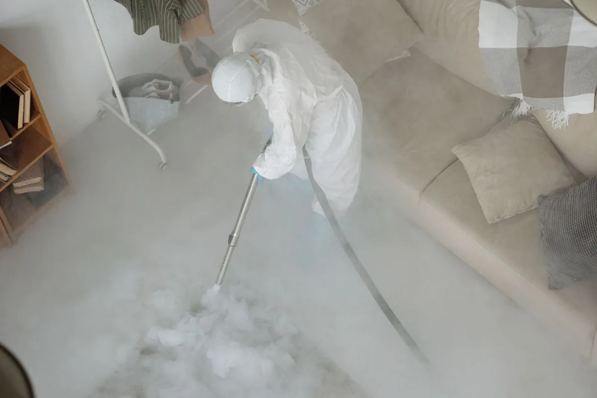 Biohazard cleanup technician in protective equipment, Pleasantville, Houston, TX